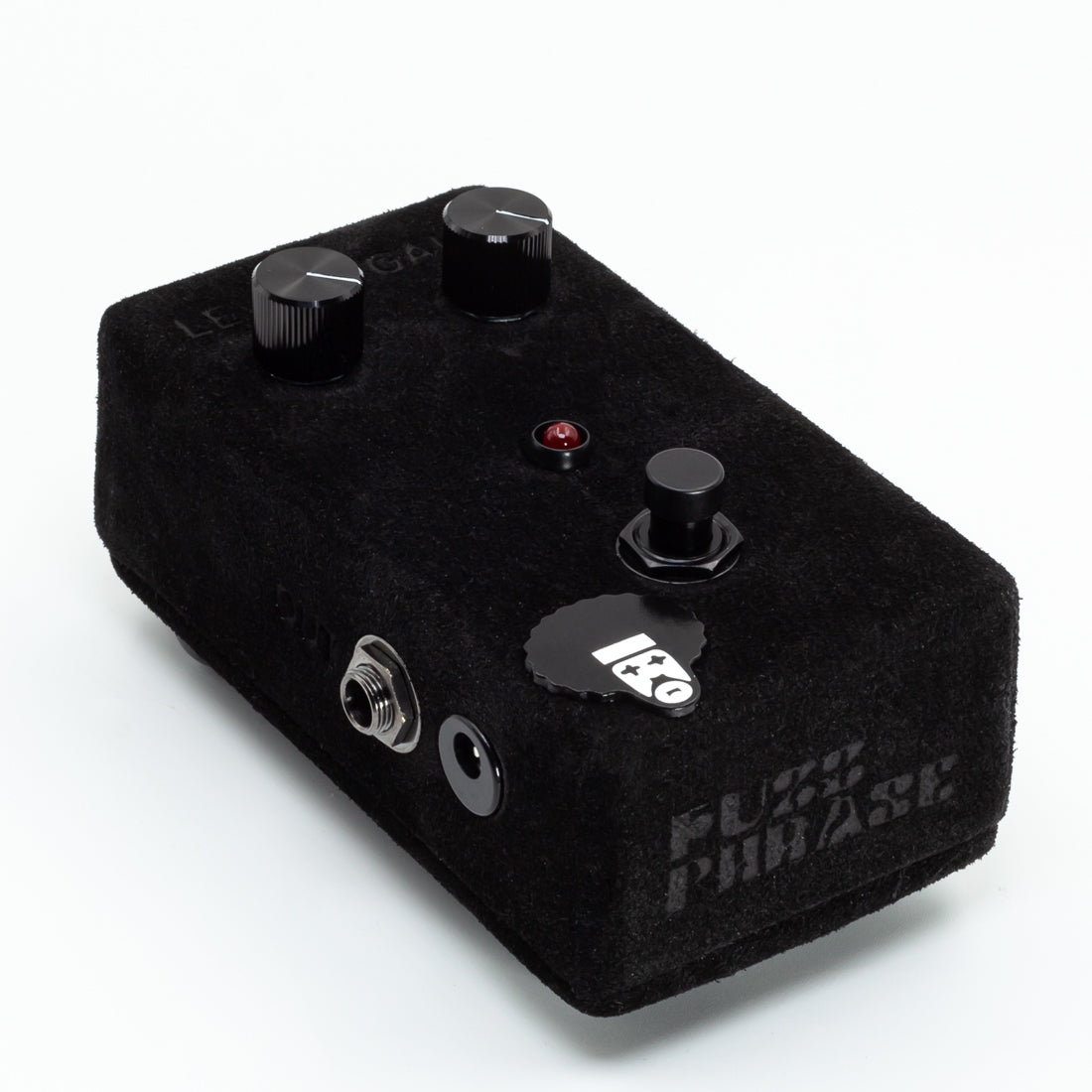 Black guitar effects pedal with 'Fuzz Phase' branding on a white background