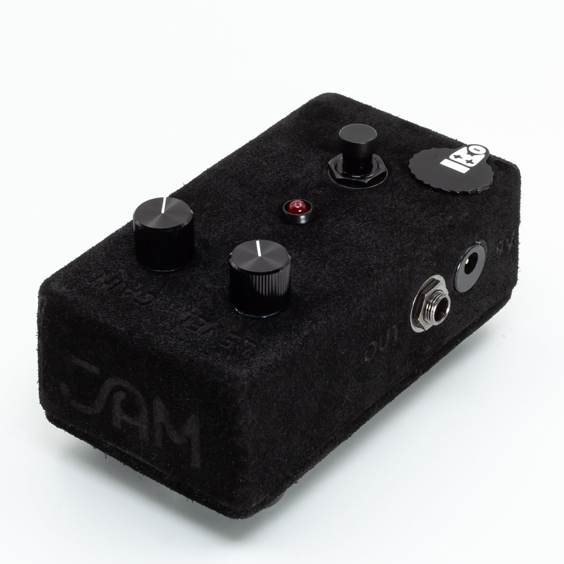 Black guitar effects pedal with visible branding on a white background