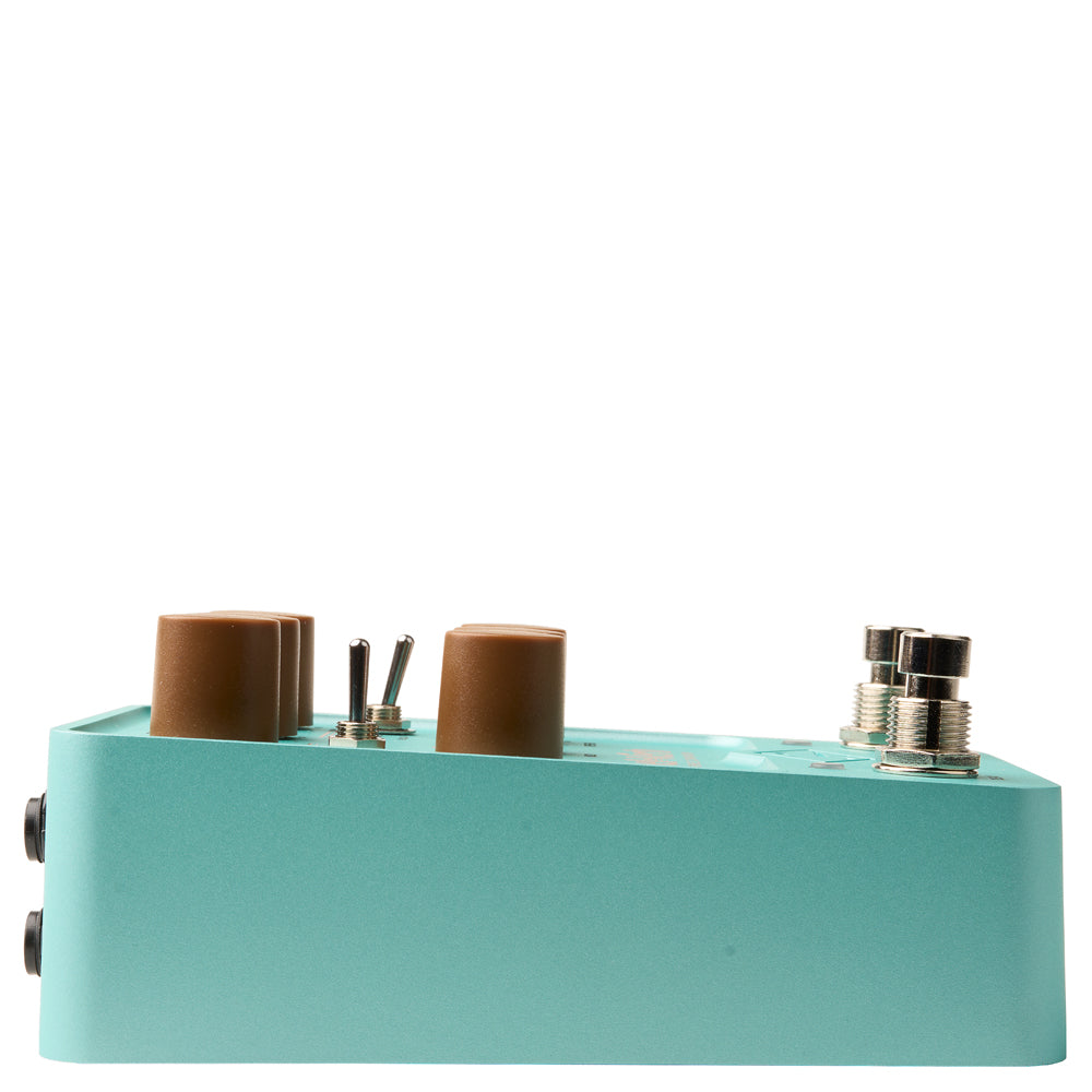 side view of a Universal Audio UAFX Del-Verb Ambience Companion Reverb & Delay pedal in blue metal with brown knobs