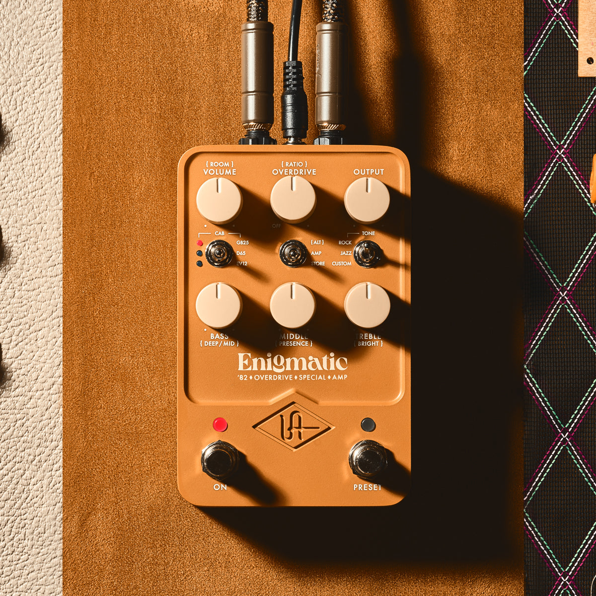 Universal Audio UAFX Enigmatic '82 Overdrive Special Amp pedal on tan suede background