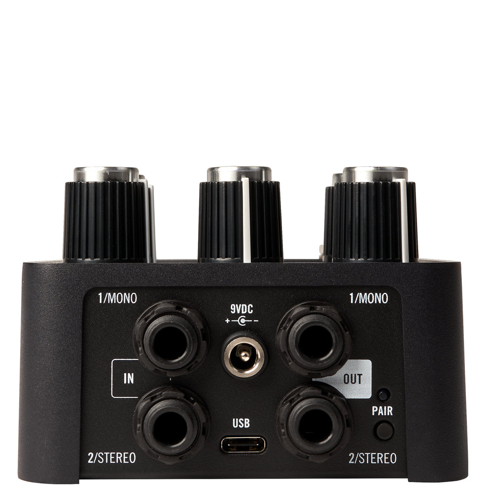 input and output channels from a Universal Audio UAFX Starlight Echo Station Delay Pedal silver and black