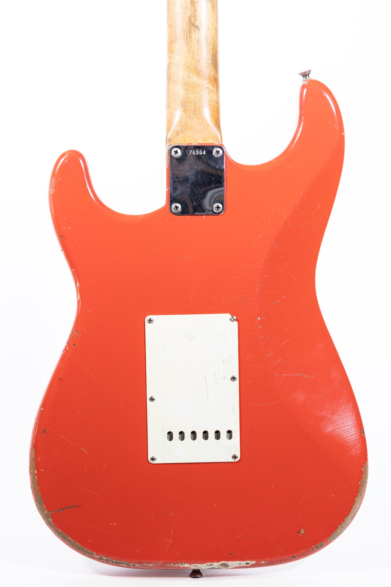 close up body back of a 1962 Fender Stratocaster finished in Fiesta Red