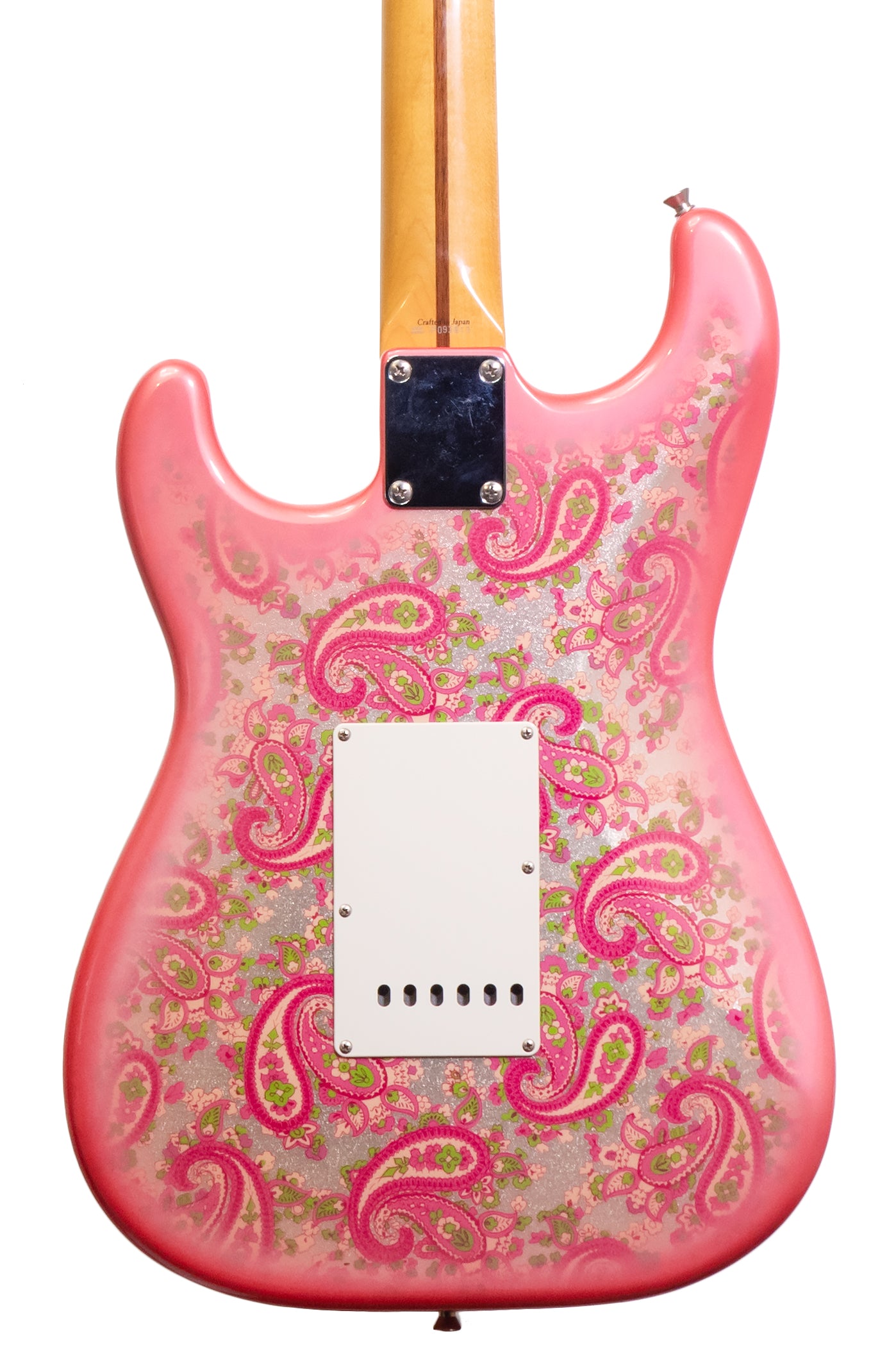 closeup of a 1999 Fender Stratocaster Reissue pink Paisley guitar MIJ
