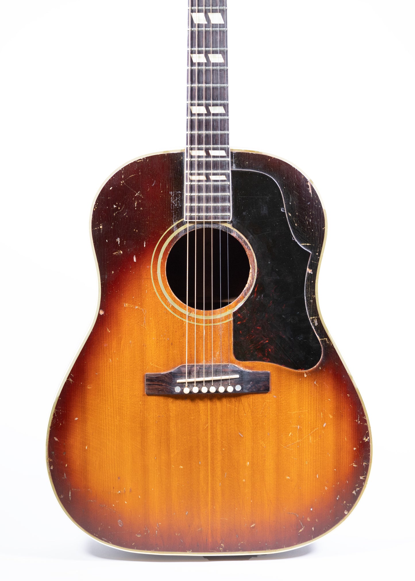 front of a vintage 1959 Gibson Southerner Jumbo acoustic guitar