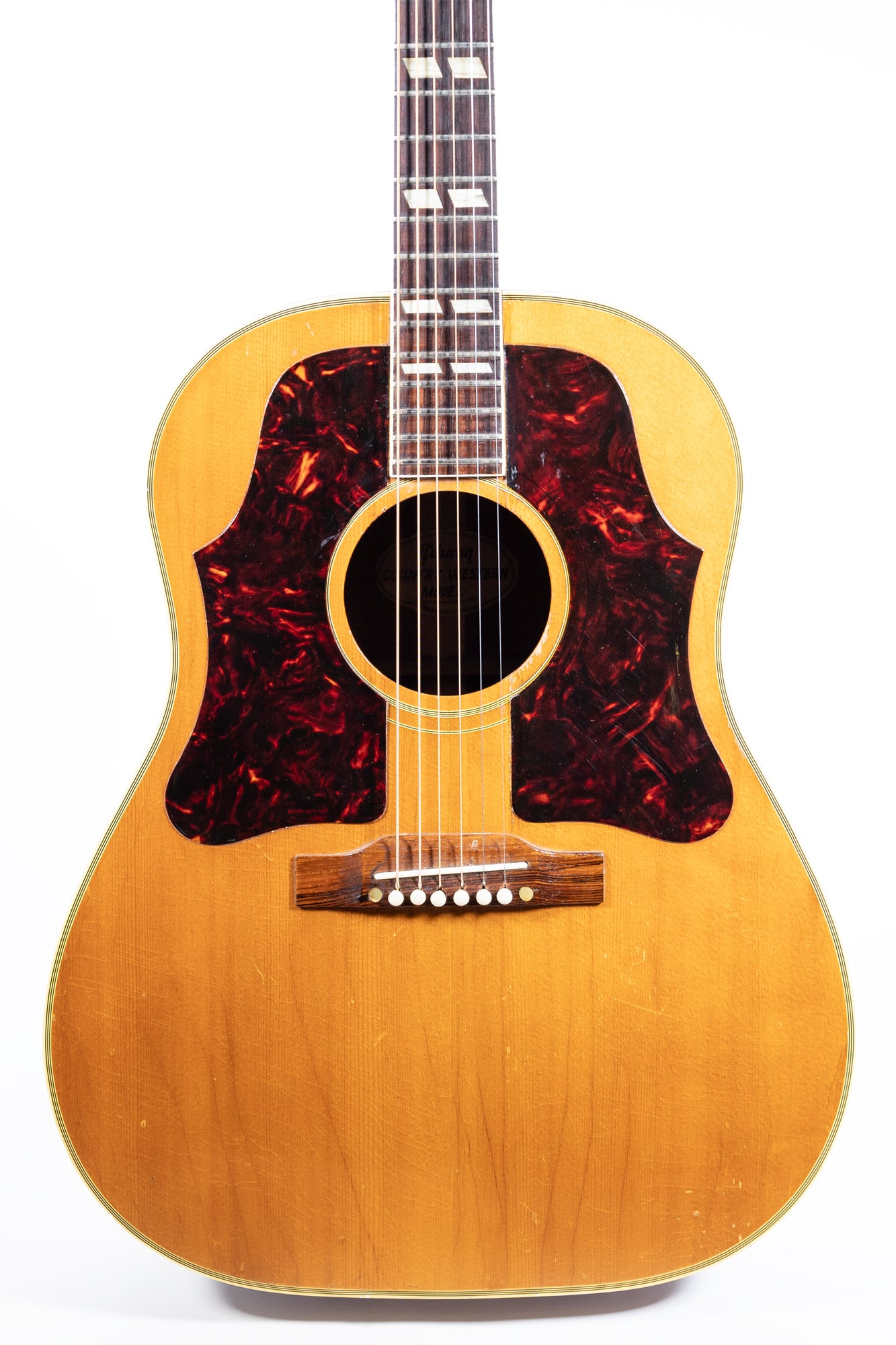 front of vintage 1960 Gibson Country Western acoustic guitar