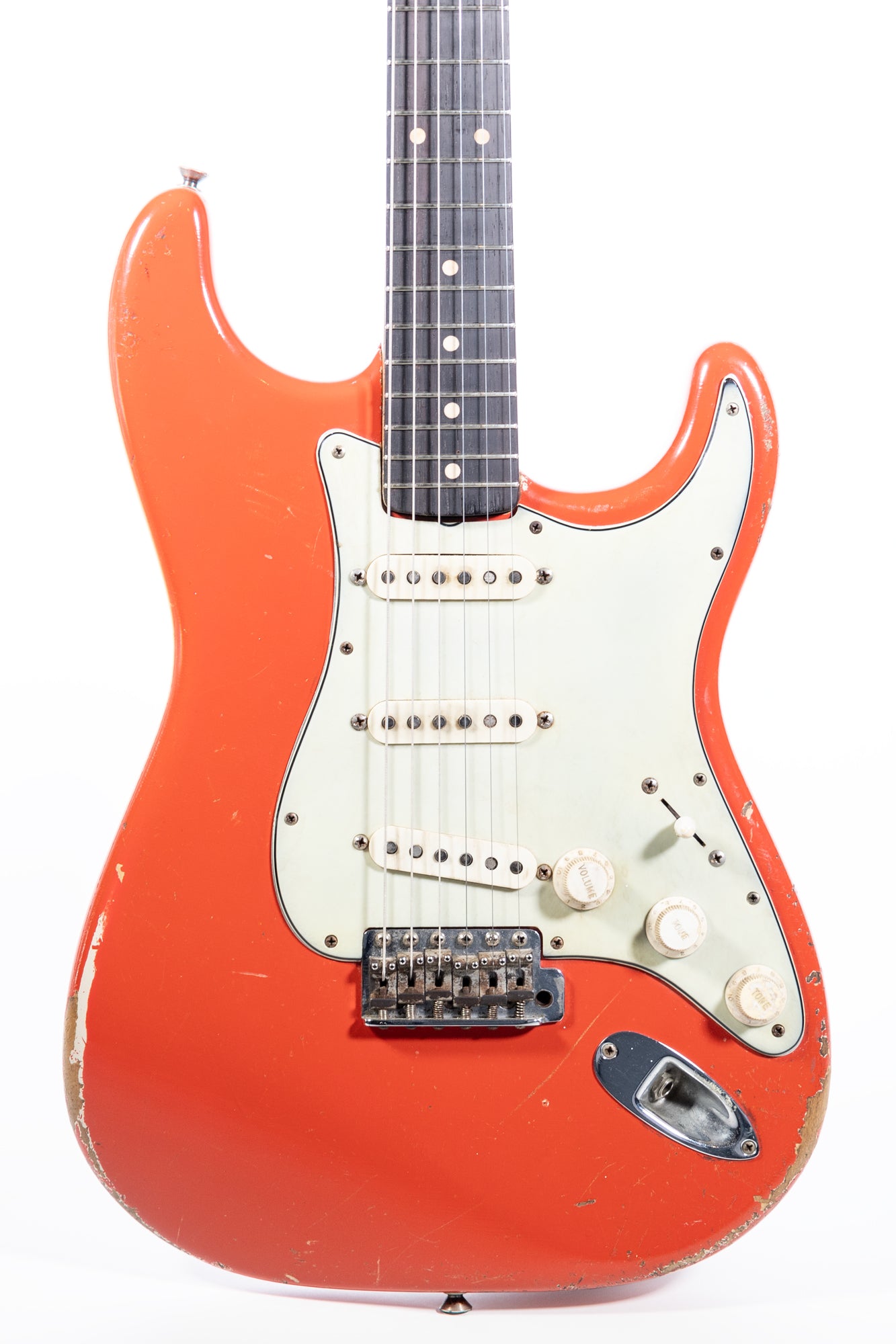 close up body front of a 1962 Fender Stratocaster finished in Fiesta Red
