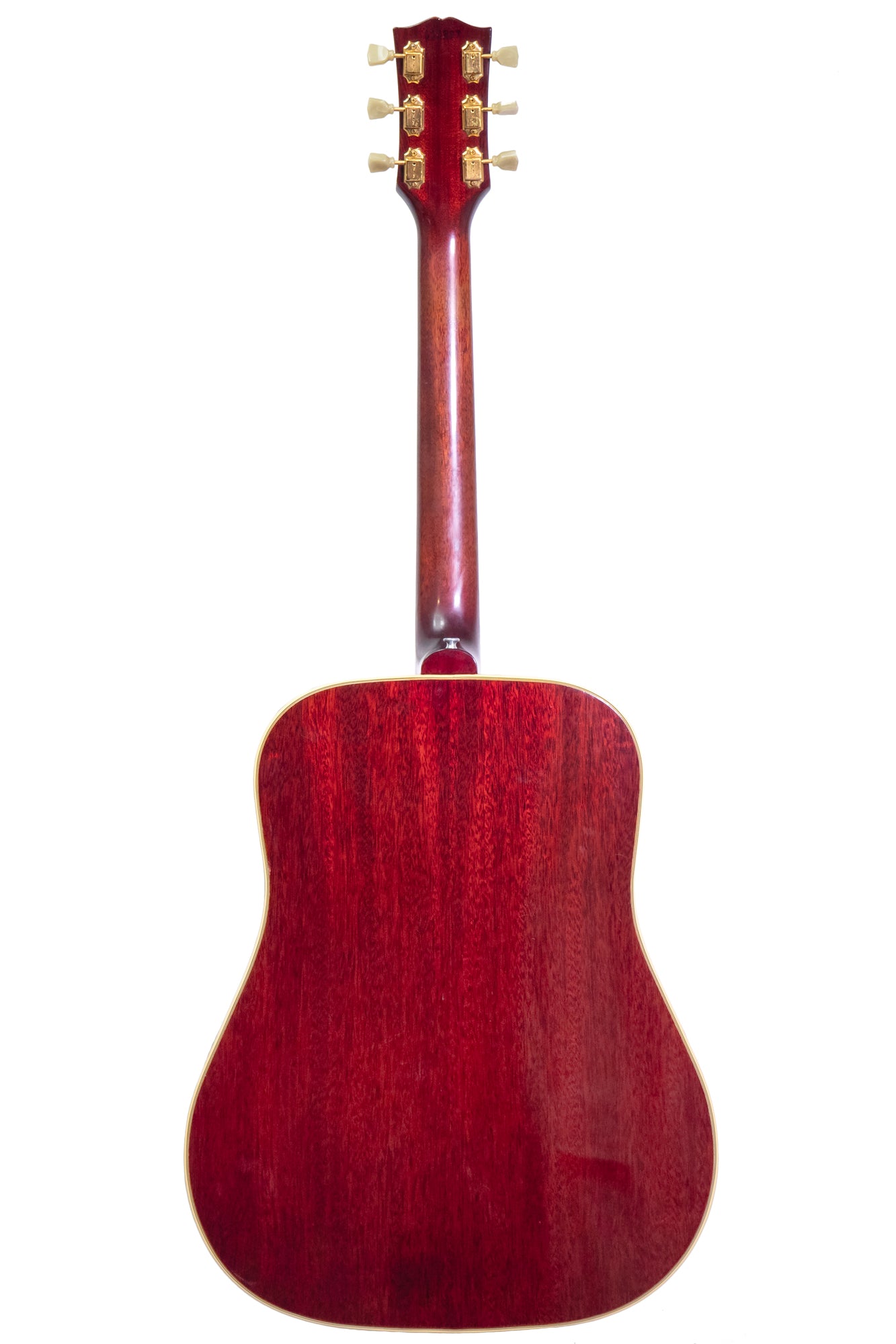 back of a Original vintage 1963 Gibson Hummingbird Acoustic Guitar in 'cherry burst'