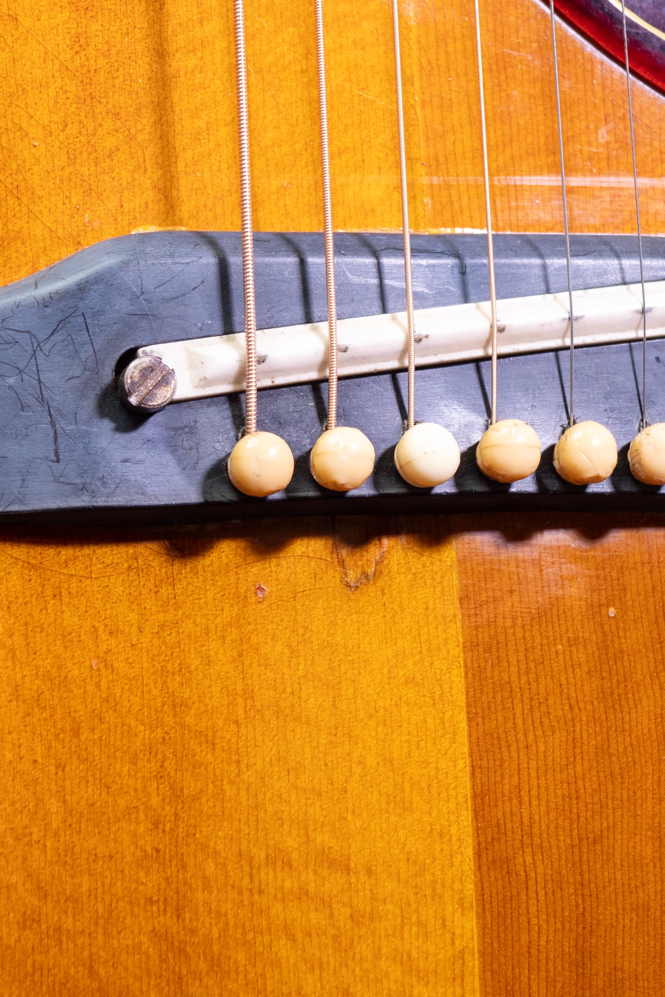 bridge from an original Original vintage 1963 Gibson Hummingbird Acoustic Guitar in 'cherry burst'