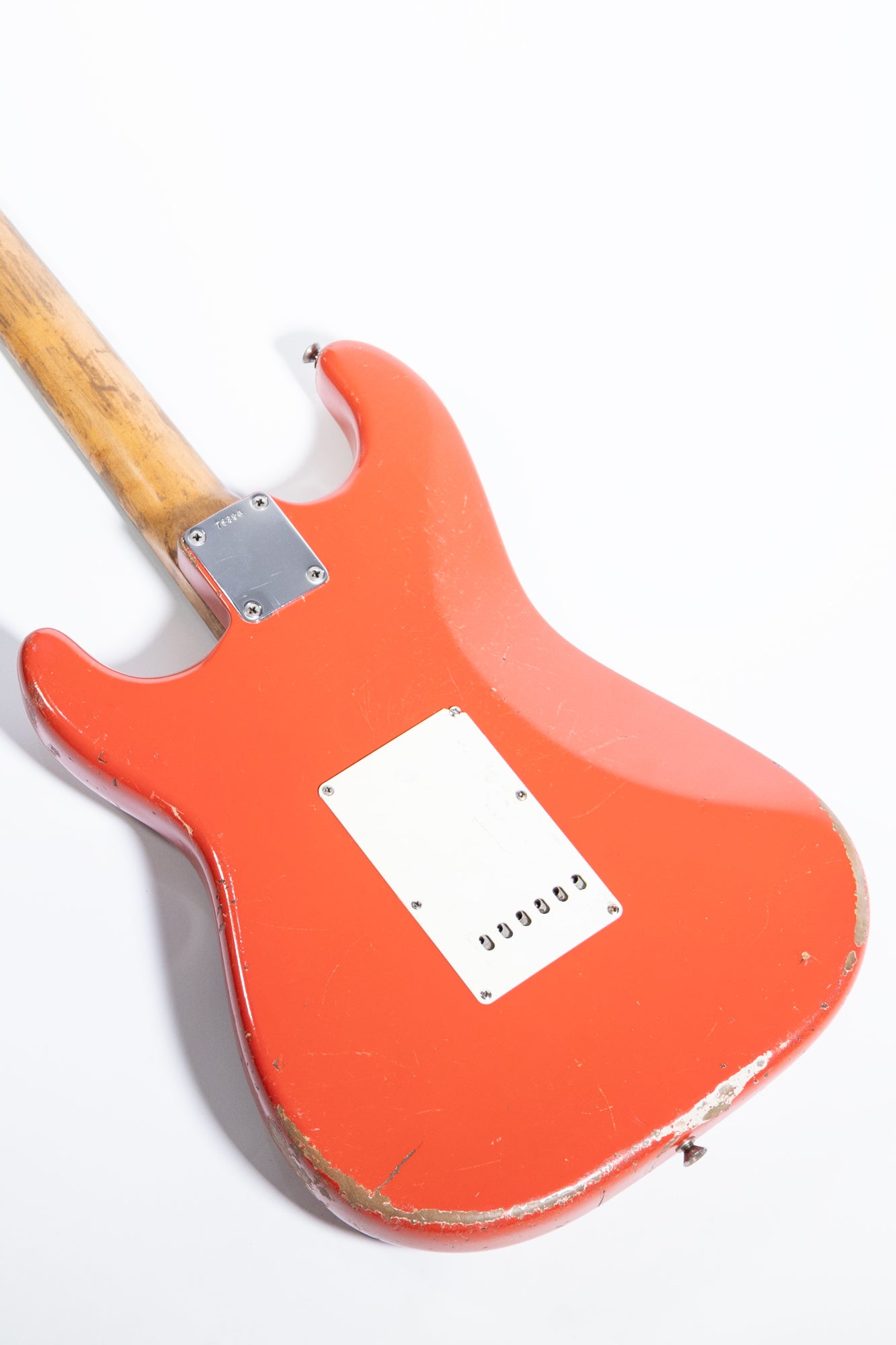 side profile of the body rear of a 1963 Fender Stratocaster finished in Fiesta Red