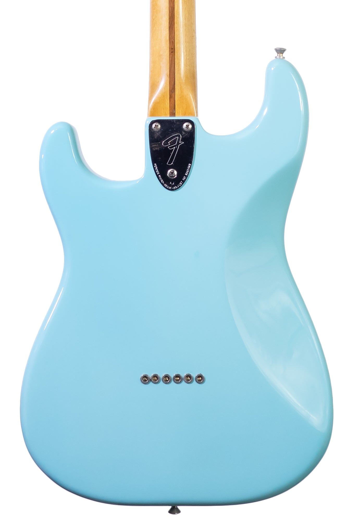 closeup of the back of a vintage 1979 Fender Stratocaster Hardtail in blue