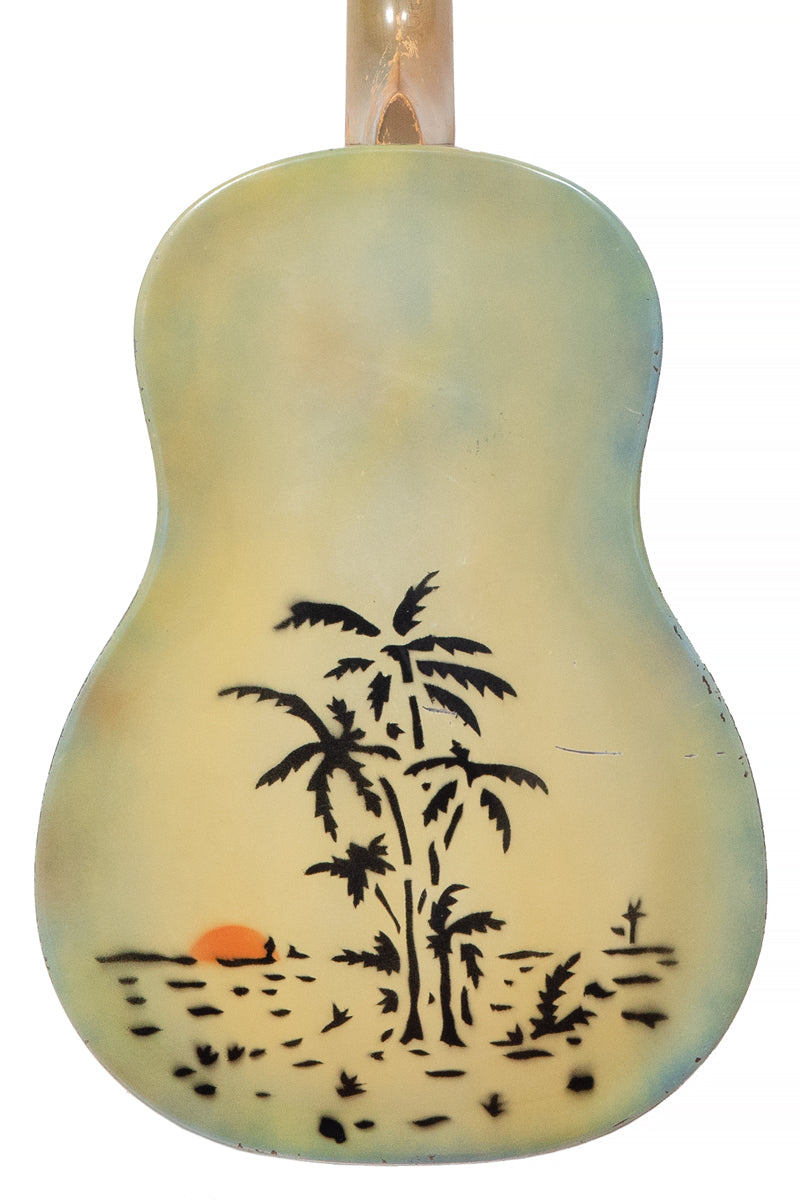 back of Vintage National Triolian Polychrome Hawaiian blues guitar with palm trees and sunrise
