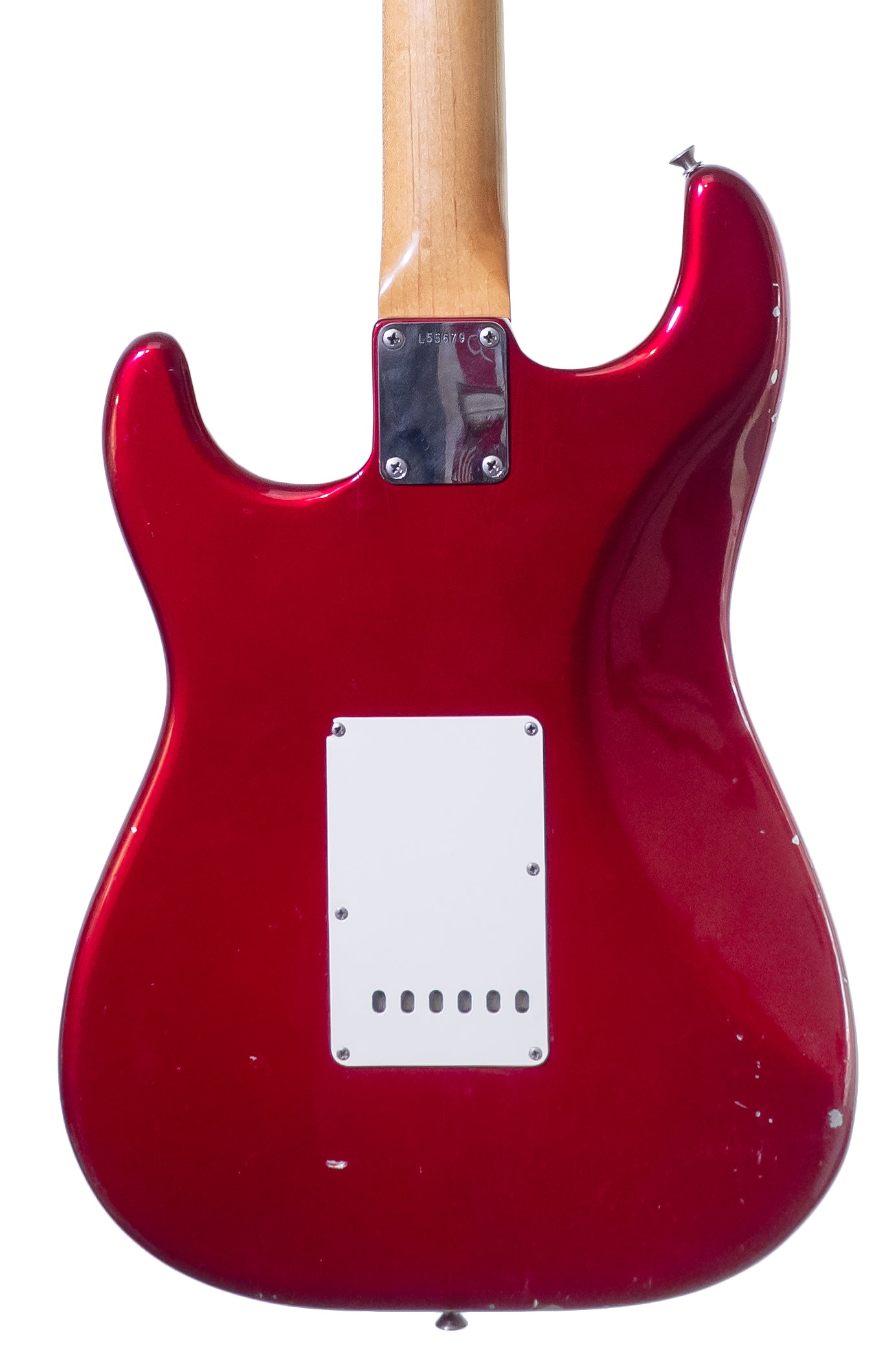 closeup of the back of a Vintage 1965 Fender Stratocaster electric guitar in candy apple red