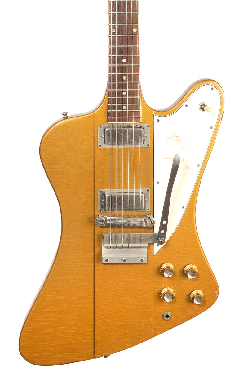 closeup of a Vintage 1965 Gibson Firebird III electric guitar in gold