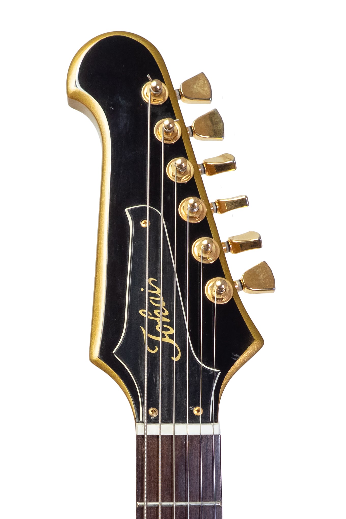 headstock from a Vintage 1996 Tokai Firebird electric guitar in gold