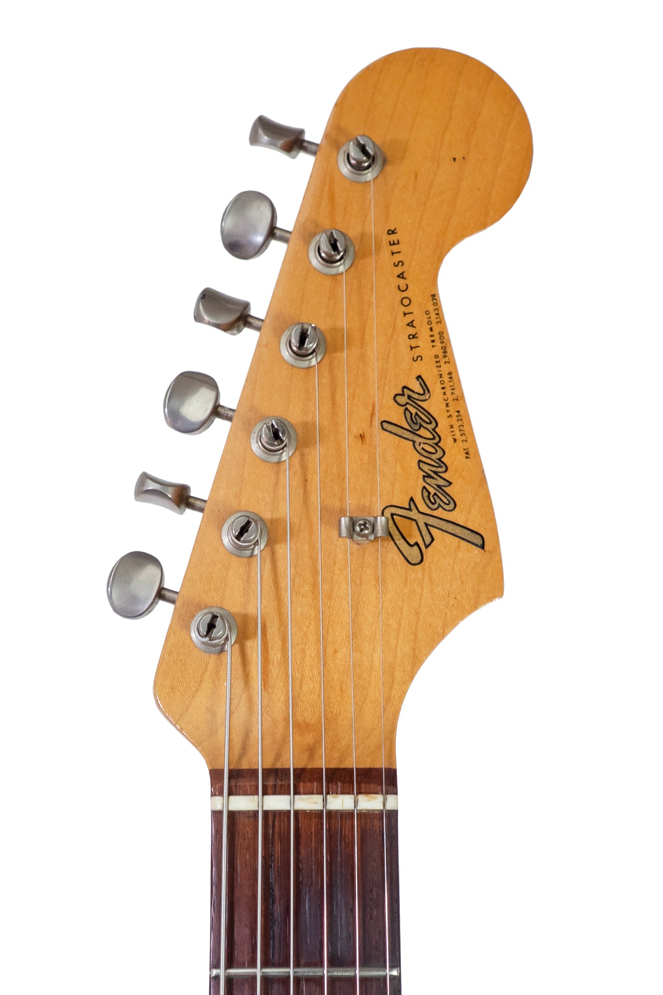 headstock from a Vintage 1965 Fender Stratocaster electric guitar in candy apple red