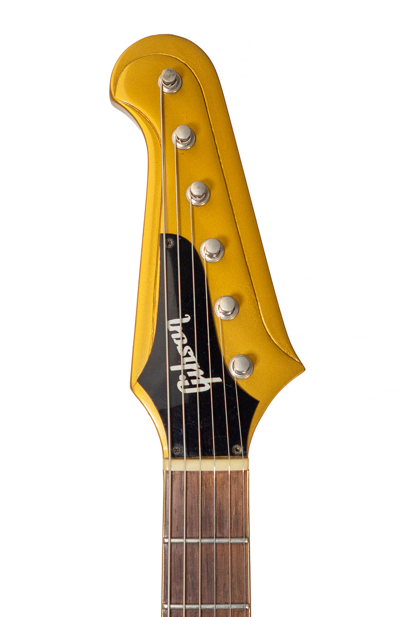 headstock from a Vintage 1965 Gibson Firebird III electric guitar in gold