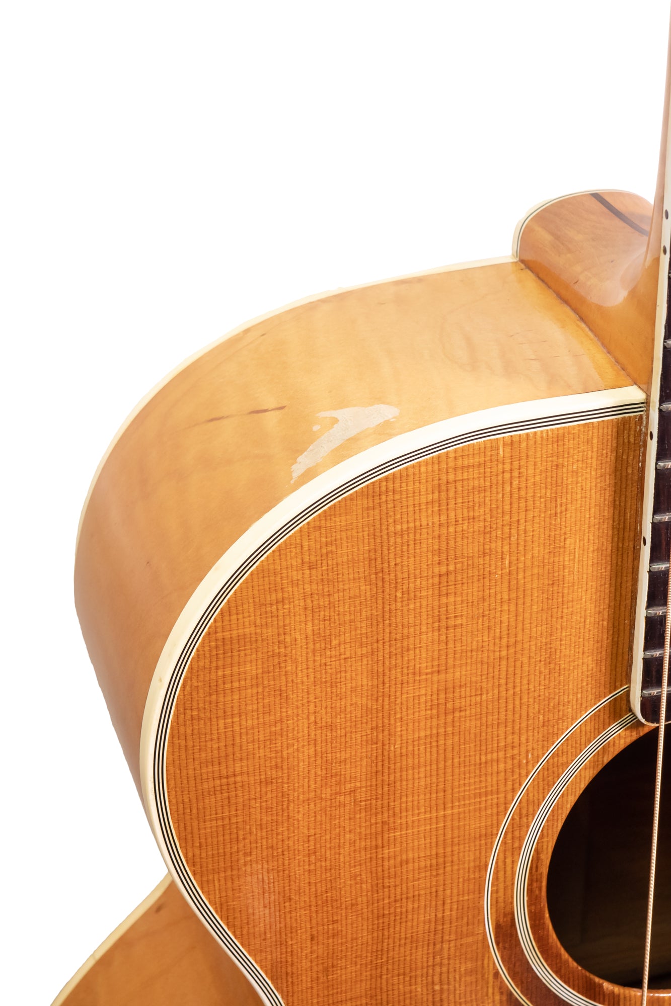 shoulder of a vintage 1953 Gibson SJ-200 jumbo acoustic guitar