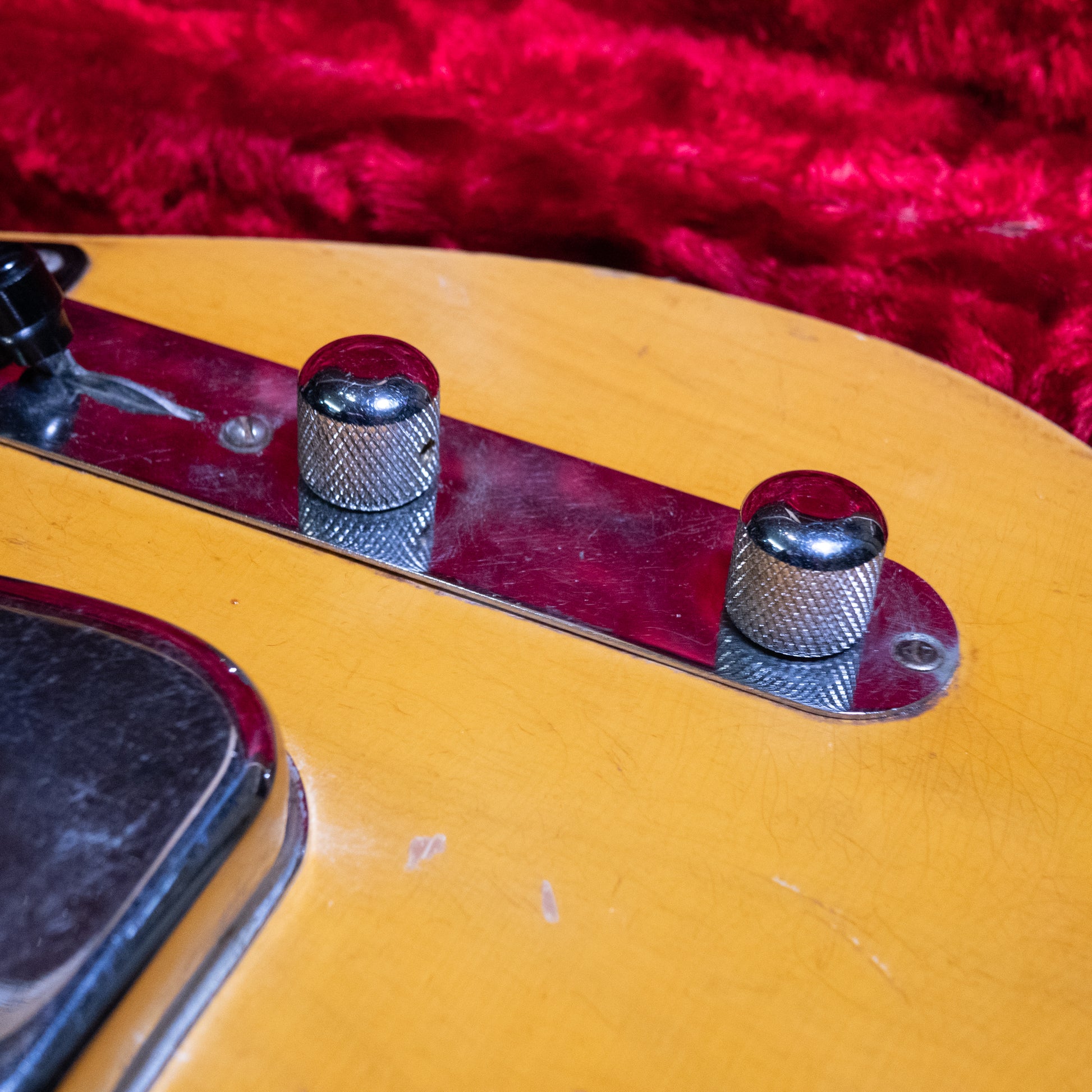 volume and tone knob from a vintage 1952 Fender Telecaster electric guitar