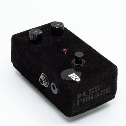 Black guitar effects pedal with 'Fuzz Phase' branding on a white background