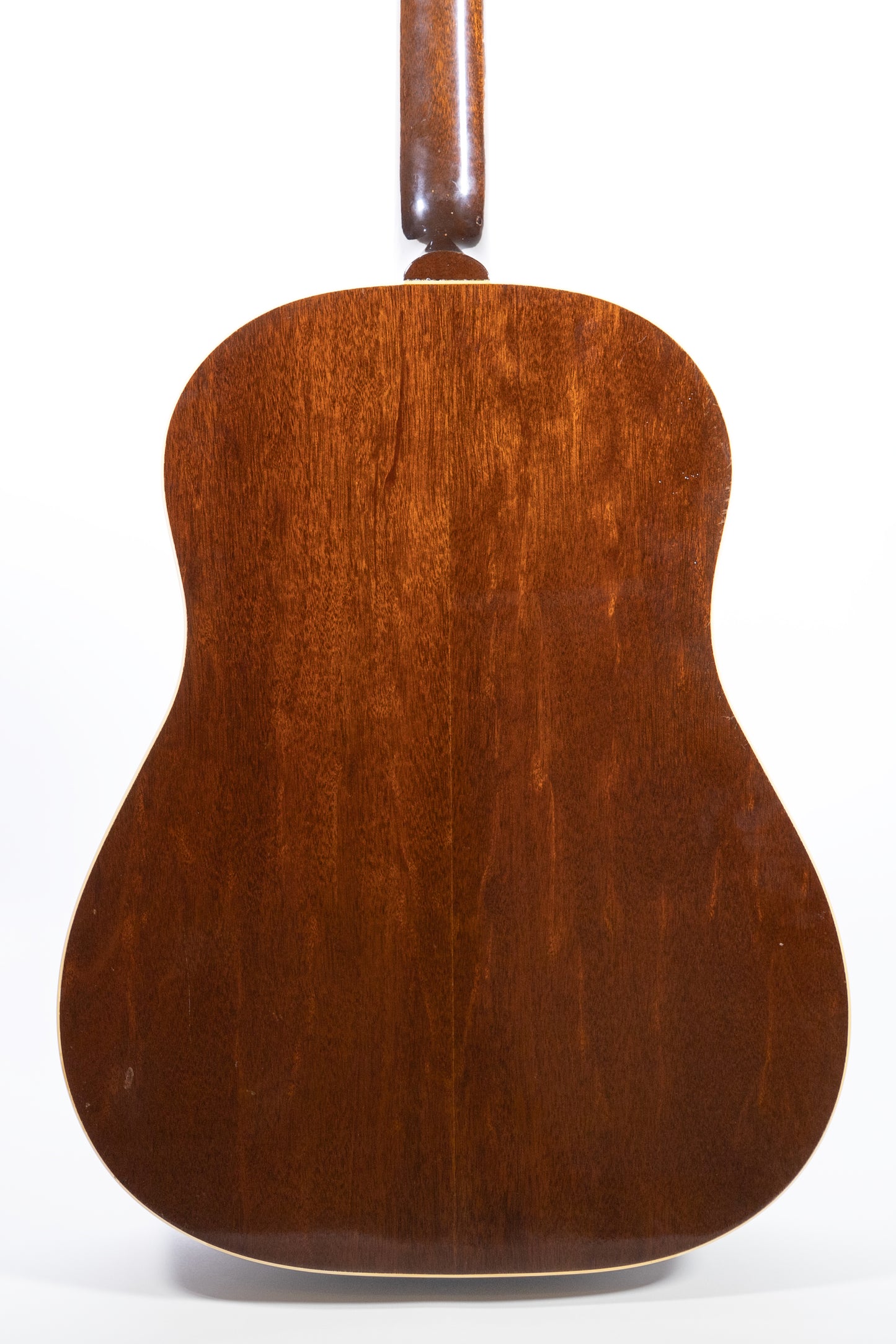 back of a vintage 1957 Gibson J-45 ADJ acoustic guitar