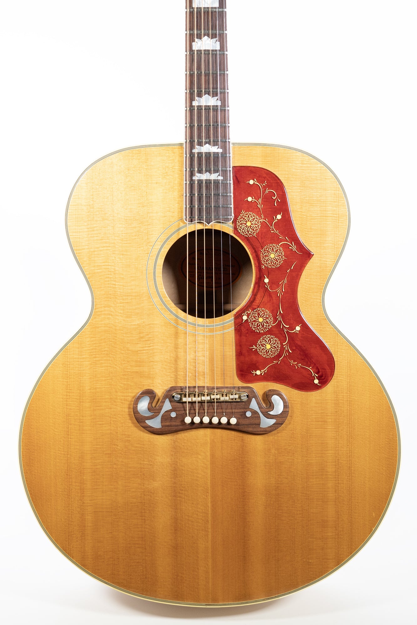 closeup of a VIntage 1966 Gibson J-200 acoustic guitar in blonde