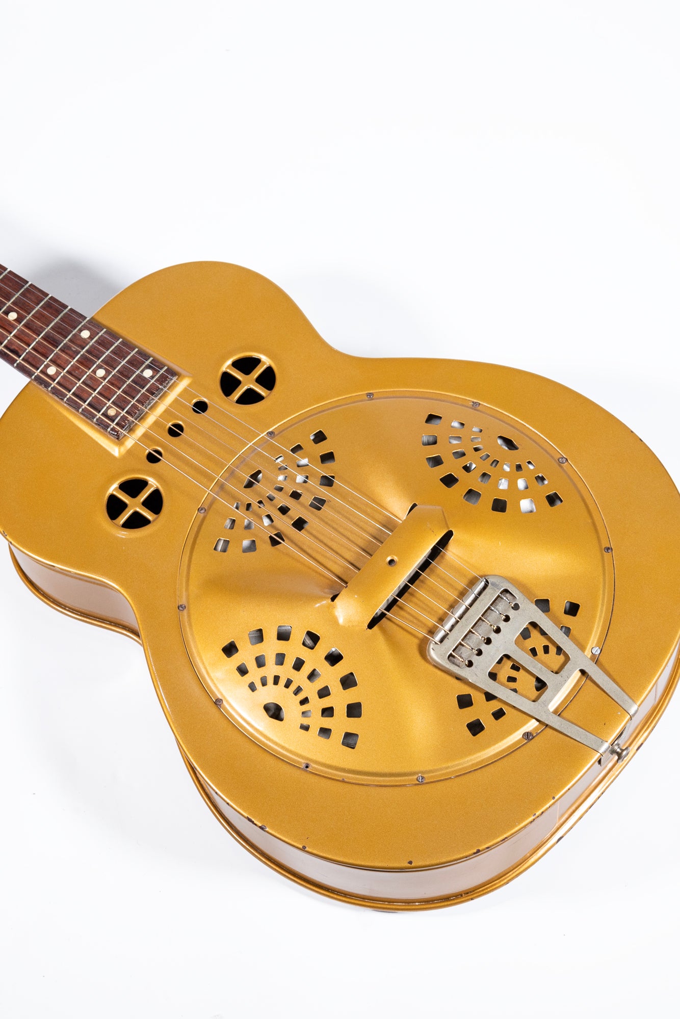 closeup of a vintage 1936 Dobro Model 32 hawaiian blues guitar in gold cone