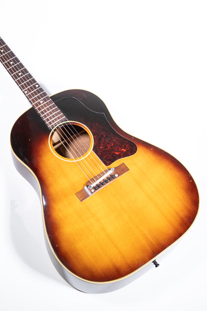 closeup of a vintage 1957 Gibson J-45 ADJ acoustic guitar