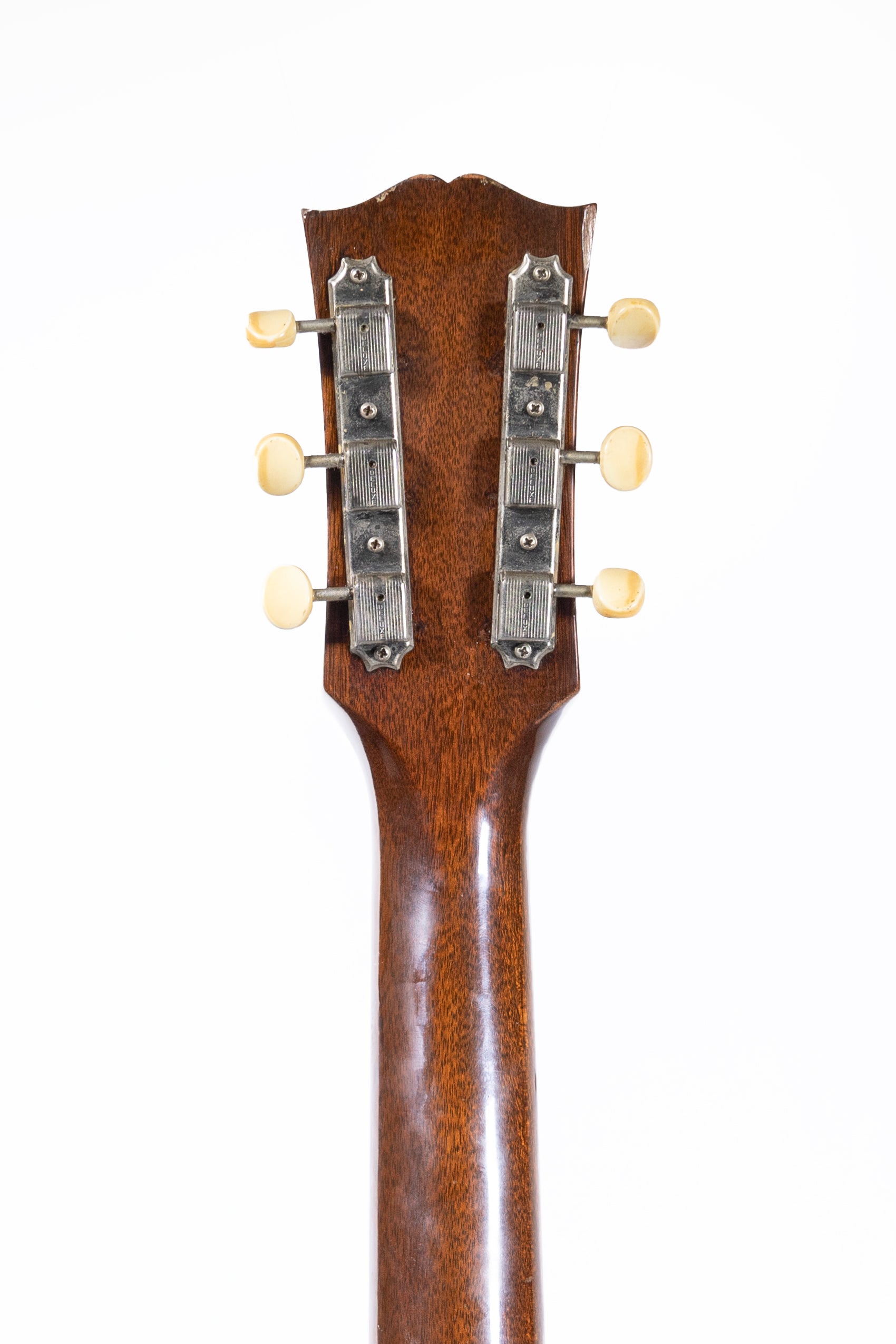 headstock and tuners from a vintage 1957 Gibson J-45 ADJ acoustic guitar