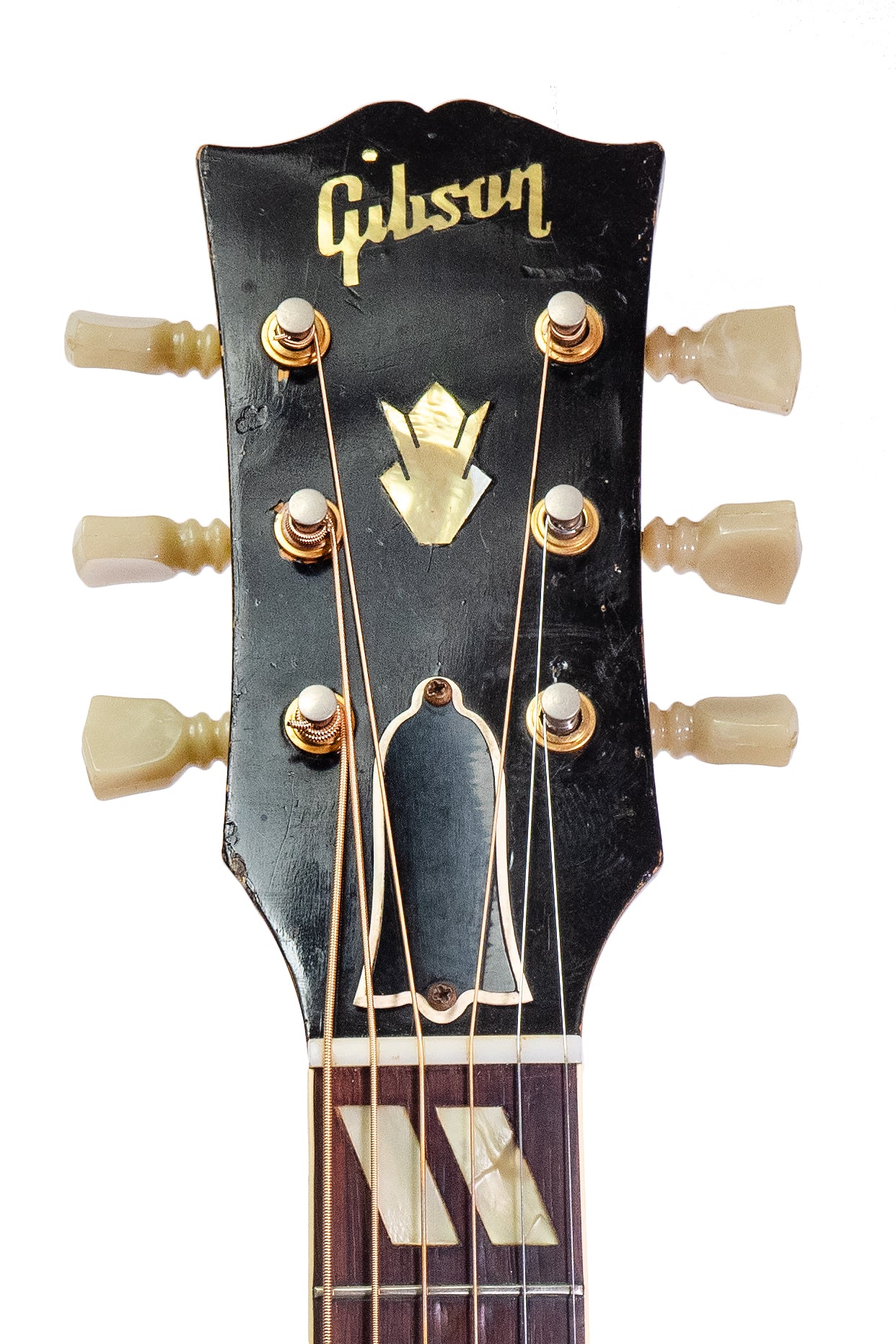 headstock from a vintage 1957 Gibson J-185 jumbo acoustic guitar