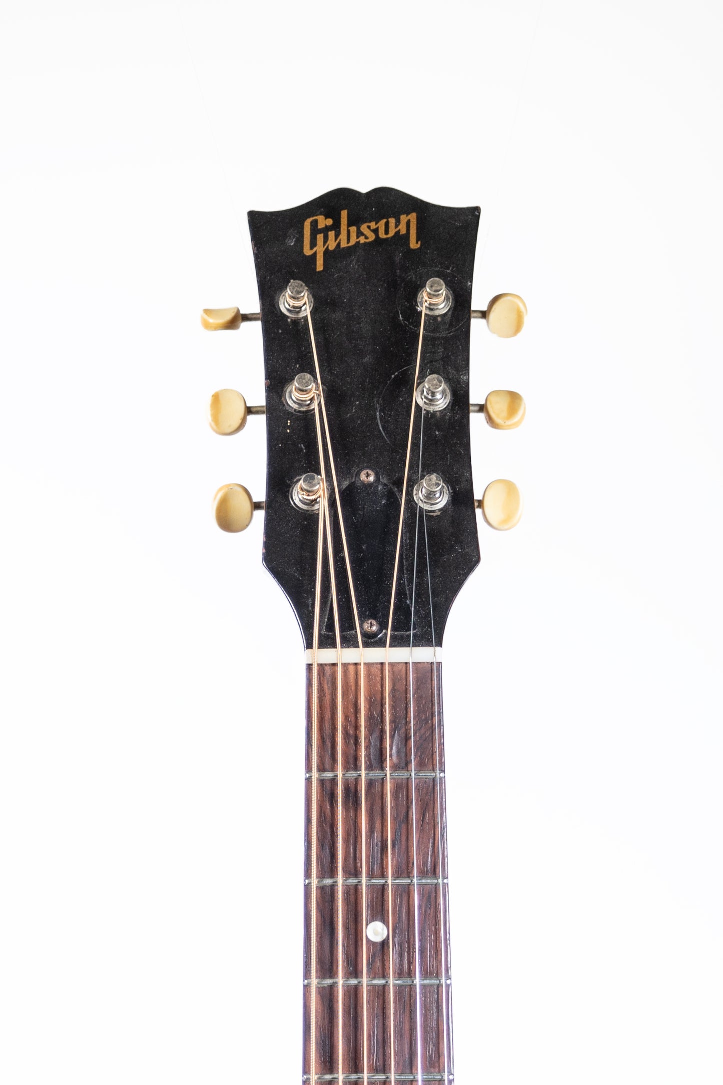 headstock from a vintage 1957 Gibson J-45 ADJ acoustic guitar