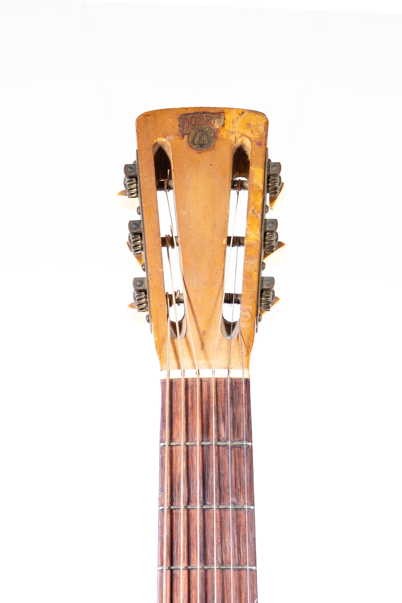 headstock from a vintage 1936 Dobro Model 32 hawaiian blues guitar in gold