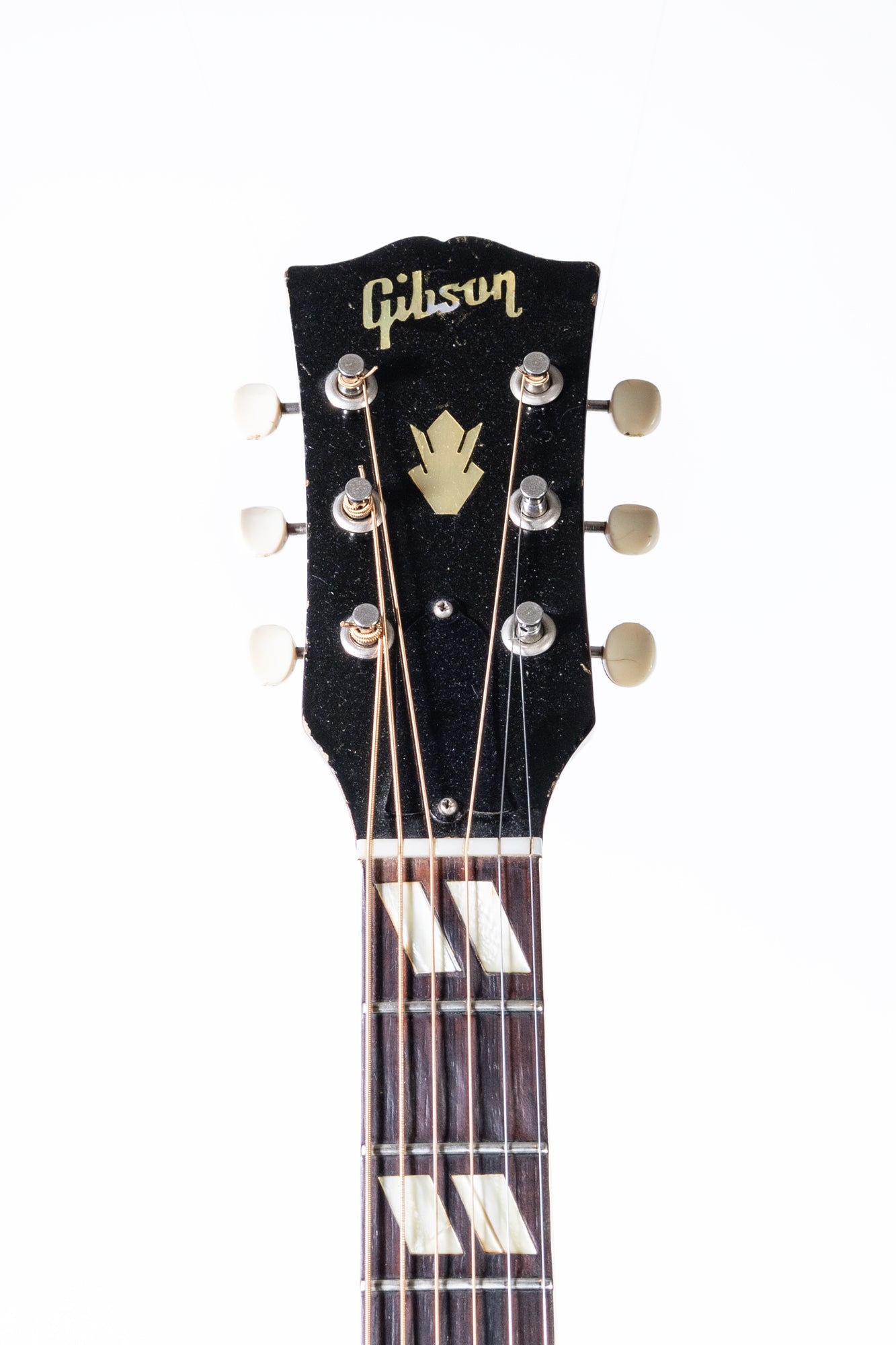 headstock of a vintage 1960 Gibson Country Western acoustic guitar