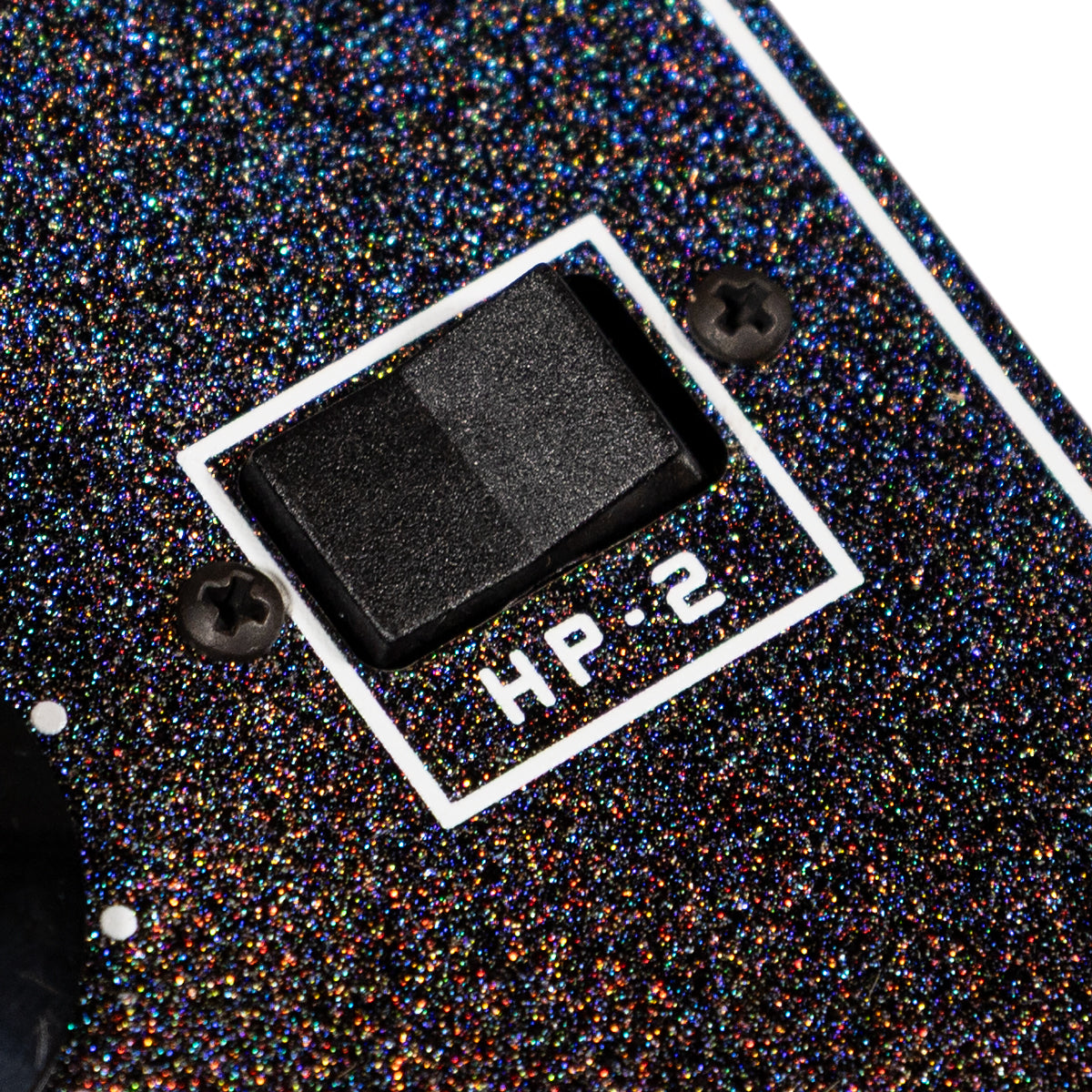 Close-up of an effects pedal with glittery surface and 'HP-2' label.