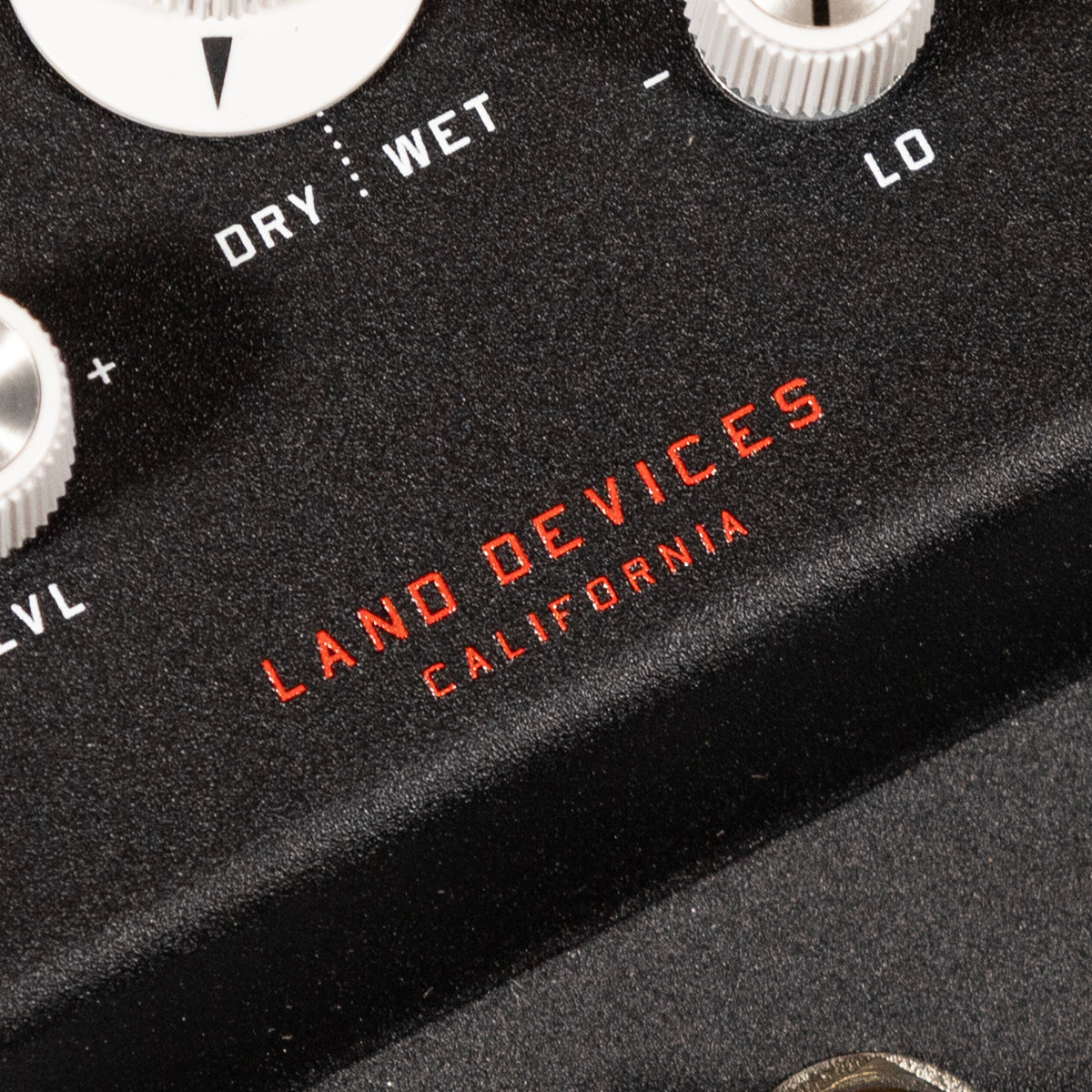 Close-up of a black electronic device with 'Land Devices California' branding.