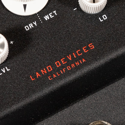 Close-up of a black electronic device with 'Land Devices California' branding.