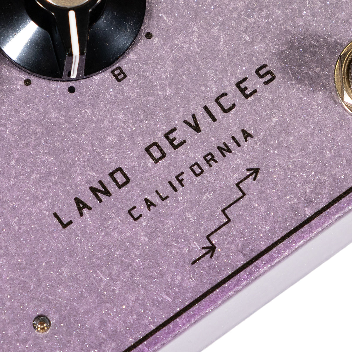 Land Devices HP-2 distortion pedal in Lilac Sparkle finish, 'Land Devices California' logo close up