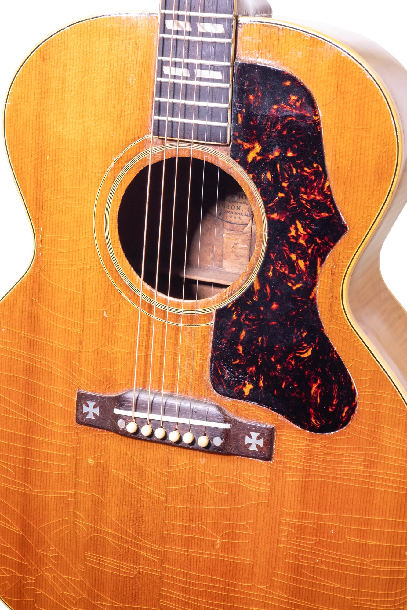 closeup of bridge from a vintage 1952 Gibson J-185 acoustic jumbo guitar