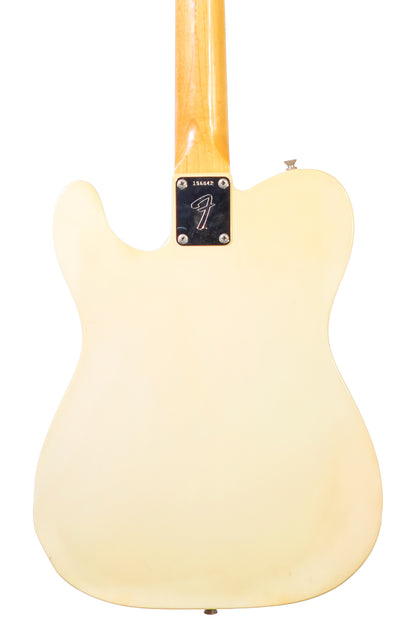 closeup of the back of a Vintage 1968 Fender Telecaster electric guitar in white