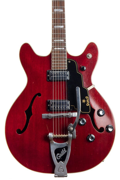 closeup of a Vintage 1965 Guild Starfire V electric guitar in red