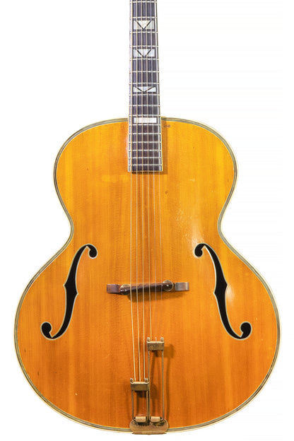 closeup of a vintage 1939 Epiphone Emperor archtop guitar